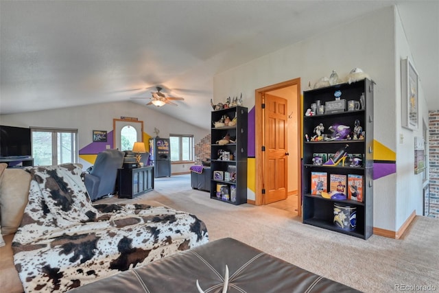 carpeted bedroom with ceiling fan and lofted ceiling