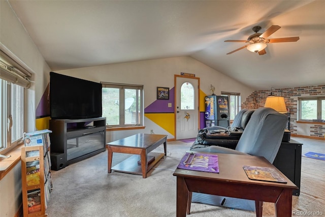 carpeted living room featuring ceiling fan and lofted ceiling