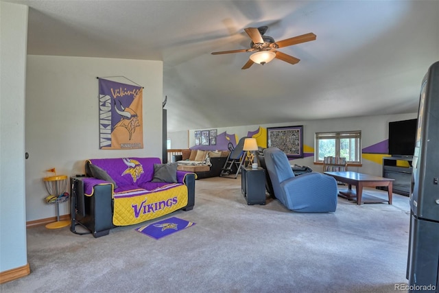 living room with carpet flooring, ceiling fan, and lofted ceiling