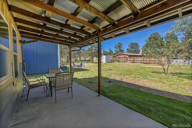 view of patio / terrace featuring a storage unit