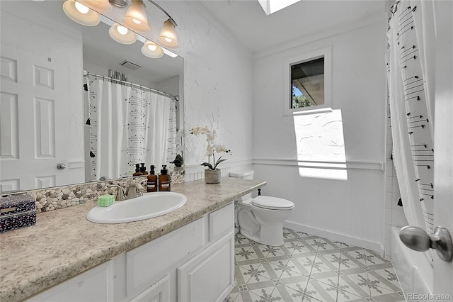 full bathroom featuring vanity, toilet, crown molding, and shower / tub combo with curtain