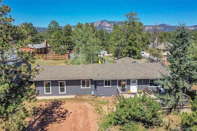 birds eye view of property featuring a mountain view