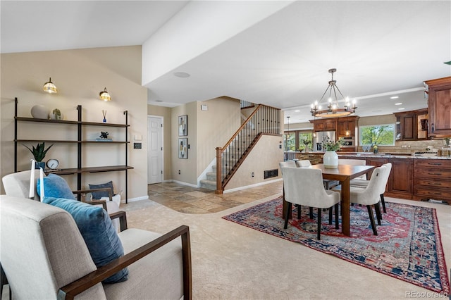3418 Elk Ct, Broomfield, CO 80020 - dining area with a chandelier, stairway, light carpet, recessed lighting, and baseboards
