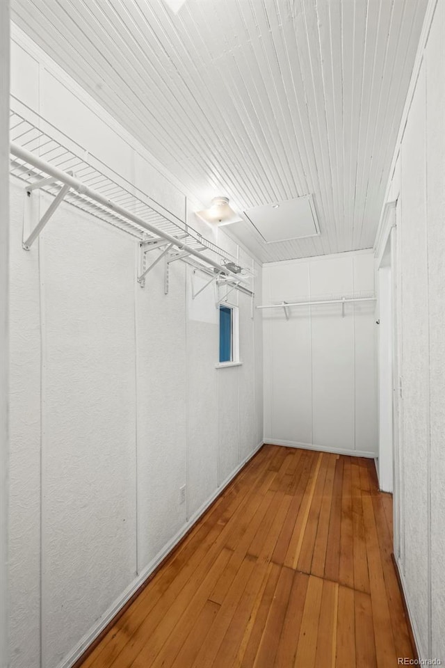 5008 Sherman St, Denver, CO 80216 - spacious closet featuring hardwood / wood-style floors and attic access