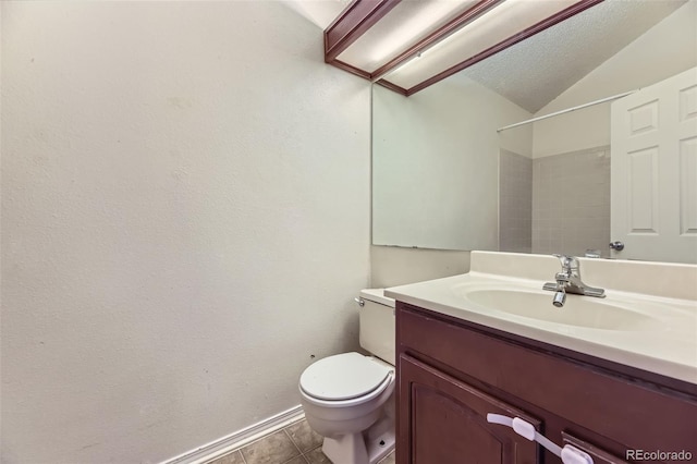 4130 E 94th Ave Unit B, Thornton, CO 80229 - bathroom with vanity, tile patterned flooring, a shower, and lofted ceiling