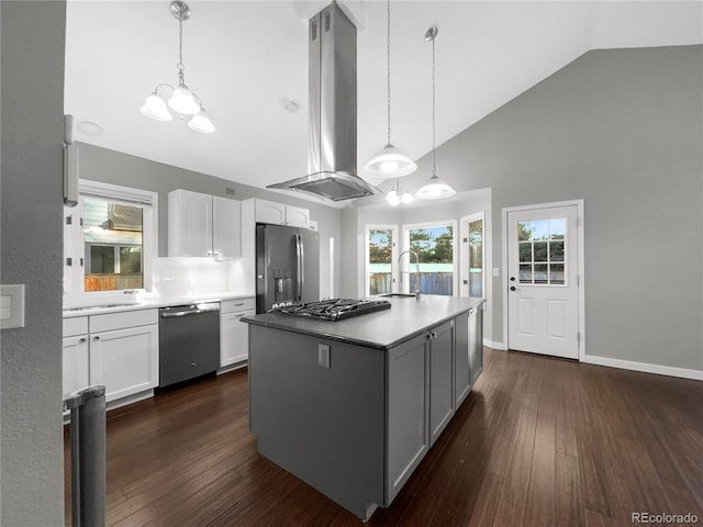 kitchen featuring sink, island range hood, appliances with stainless steel finishes, a kitchen island, and white cabinets