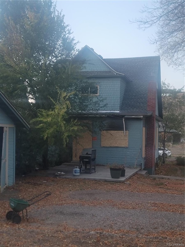 view of side of property featuring a patio