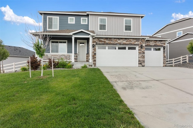 2248 Rosette Ln, Castle Rock, CO 80104 - view of front of house with concrete driveway, a porch, stone siding, board and batten siding, and an attached garage