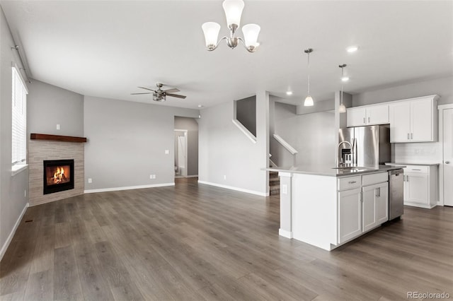 2248 Rosette Ln, Castle Rock, CO 80104 - kitchen featuring appliances with stainless steel finishes, ceiling fan, dark wood-type flooring, open floor plan, and decorative light fixtures