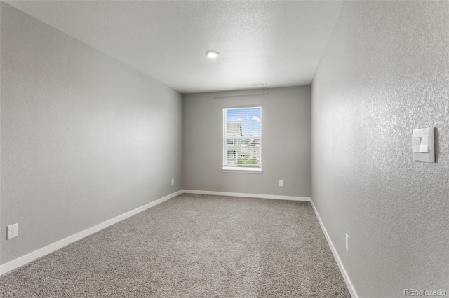 2248 Rosette Ln, Castle Rock, CO 80104 - carpeted spare room featuring a textured wall and baseboards