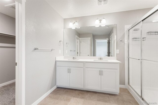 2248 Rosette Ln, Castle Rock, CO 80104 - full bath featuring double vanity, a shower stall, and a walk in closet