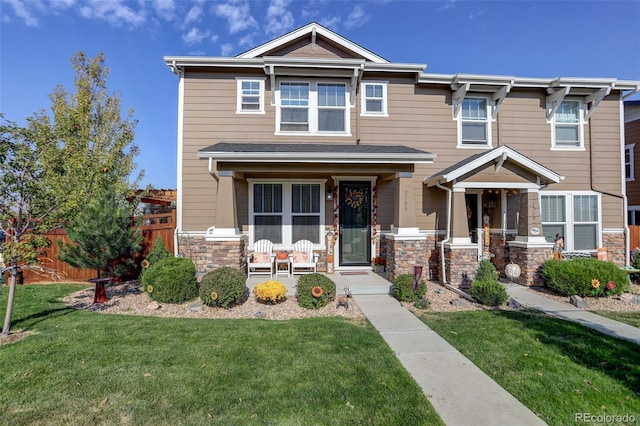 view of front of home with a front lawn and a porch