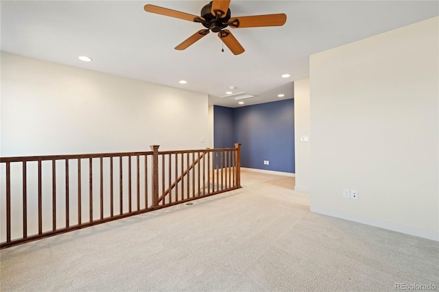 carpeted empty room featuring ceiling fan