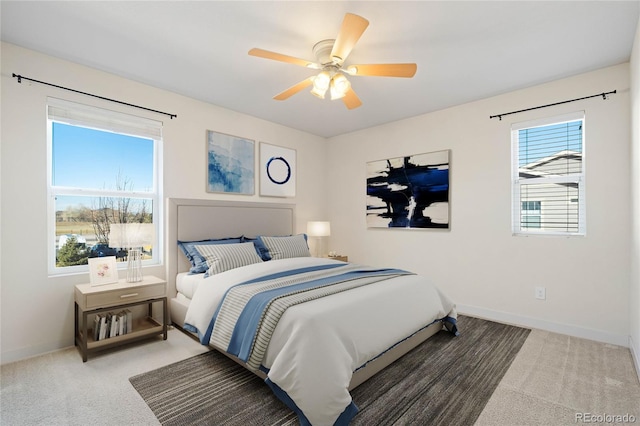 bedroom featuring a ceiling fan, baseboards, and carpet floors