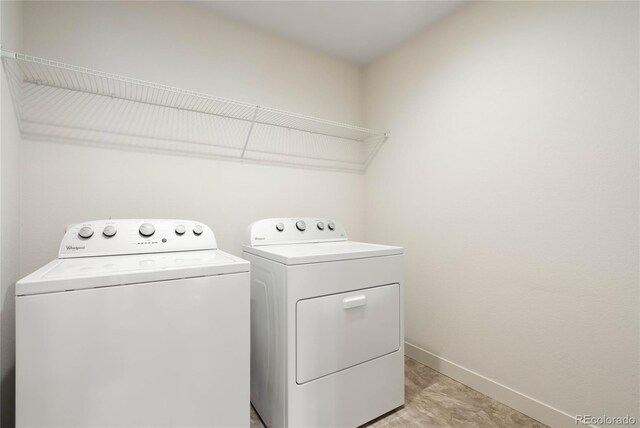 clothes washing area featuring independent washer and dryer