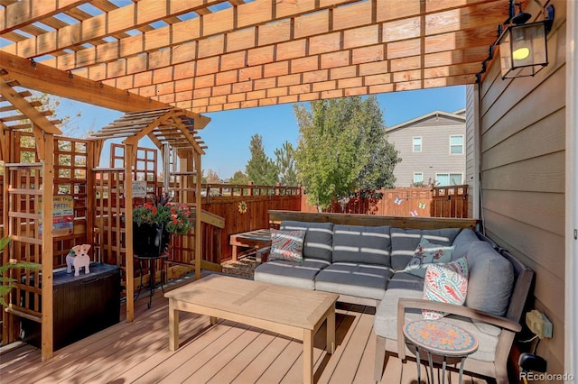 deck featuring fence, a pergola, and an outdoor hangout area