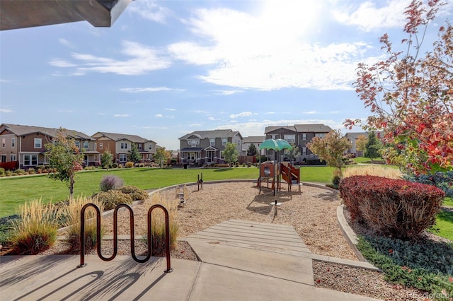 community playground with a yard and a residential view