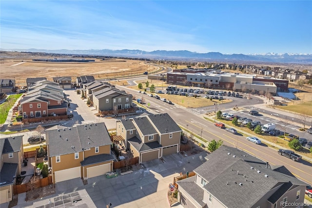 birds eye view of property featuring a mountain view and a residential view