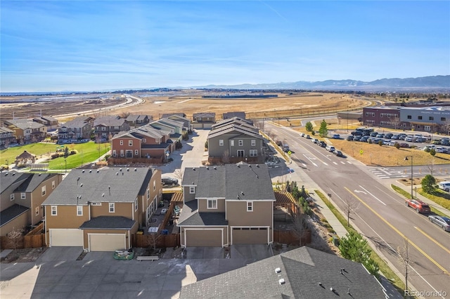 aerial view featuring a mountain view and a residential view