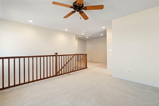 carpeted empty room featuring recessed lighting and baseboards