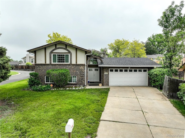 9642 Meade Ct, Westminster, CO 80031 - view of front facade featuring a garage, brick siding, concrete driveway, and stucco siding