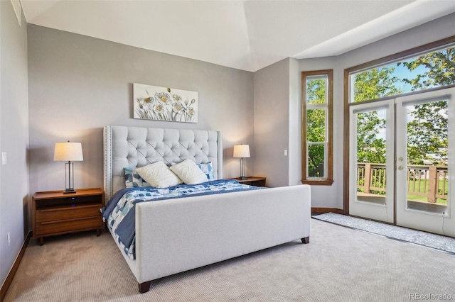 carpeted bedroom featuring access to exterior and baseboards
