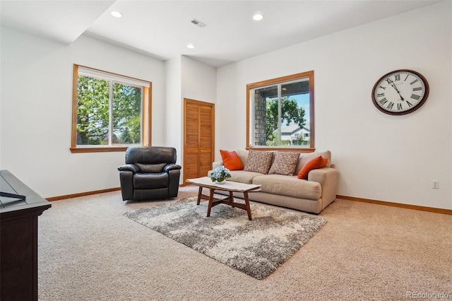 living area featuring carpet floors, plenty of natural light, baseboards, and recessed lighting