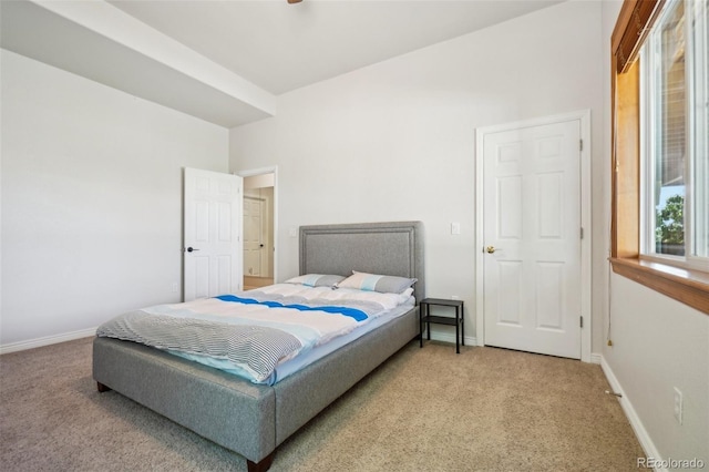 bedroom featuring carpet floors and baseboards