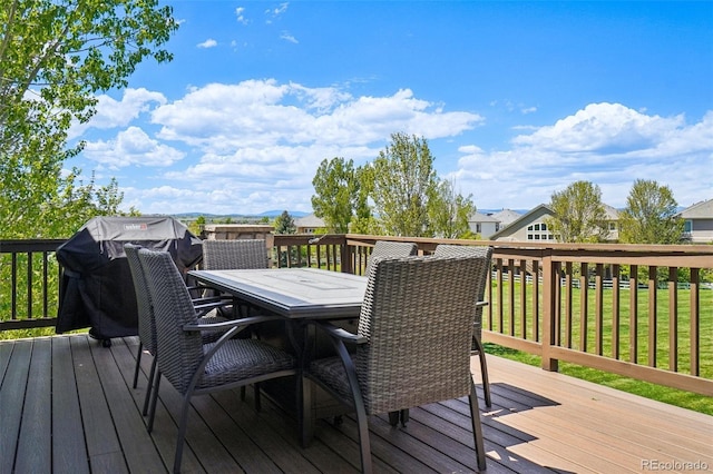 wooden terrace featuring outdoor dining area