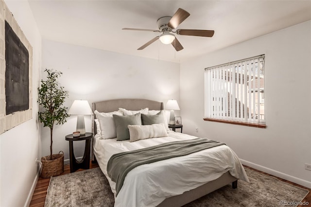 bedroom featuring ceiling fan and dark wood-type flooring