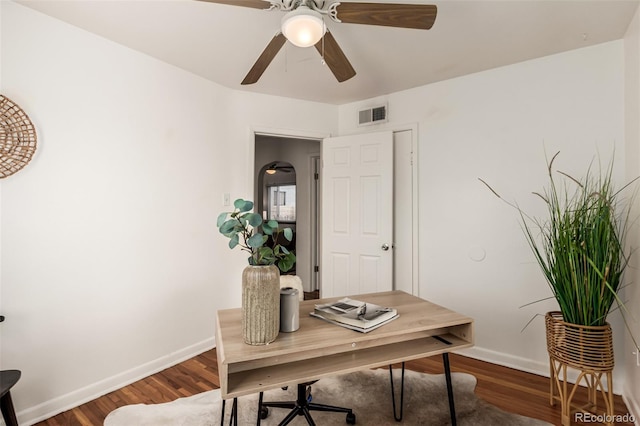 home office featuring dark hardwood / wood-style floors and ceiling fan