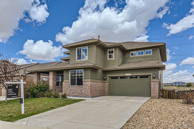 4406 Sidewinder Loop, Castle Rock, CO 80108 - prairie-style house with brick siding, an attached garage, concrete driveway, and roof with shingles