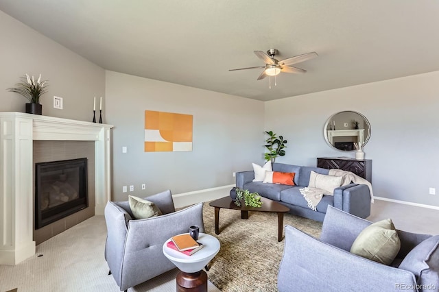 4406 Sidewinder Loop, Castle Rock, CO 80108 - living room featuring light colored carpet, a glass covered fireplace, a ceiling fan, and baseboards