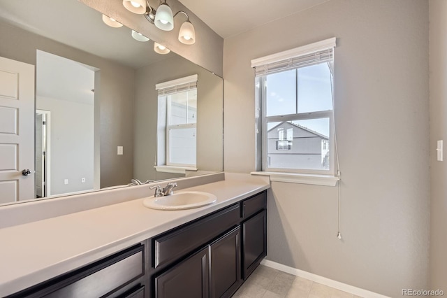 4406 Sidewinder Loop, Castle Rock, CO 80108 - bathroom featuring baseboards, vanity, and tile patterned floors