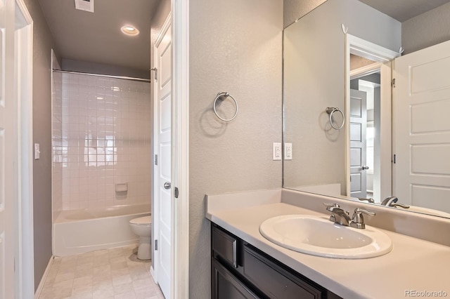 4406 Sidewinder Loop, Castle Rock, CO 80108 - bathroom featuring vanity, toilet,  shower combination, recessed lighting, and a textured wall