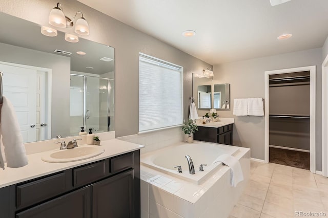 4406 Sidewinder Loop, Castle Rock, CO 80108 - full bath with a shower stall, a bath, tile patterned floors, two vanities, and a walk in closet