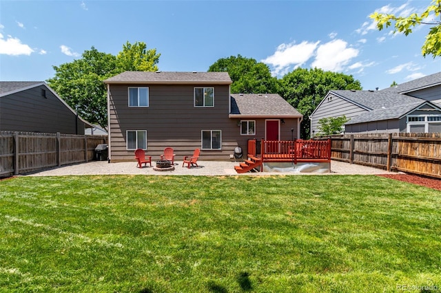12908 Hudson St, Thornton, CO 80241 - rear view of property with a patio area, a wooden deck, a fenced backyard, and an outdoor fire pit