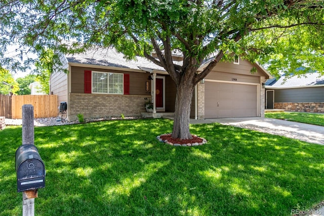 12908 Hudson St, Thornton, CO 80241 - view of front of home featuring brick siding, concrete driveway, and a garage