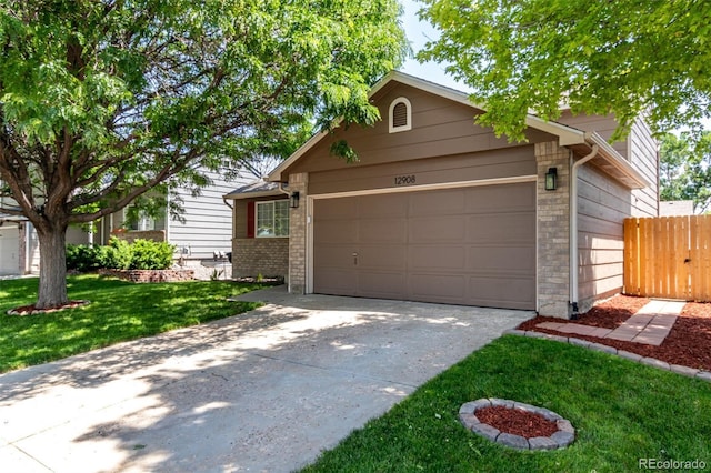 12908 Hudson St, Thornton, CO 80241 - view of front facade with driveway and a garage