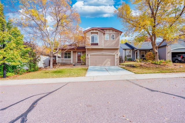 traditional home featuring a garage and concrete driveway