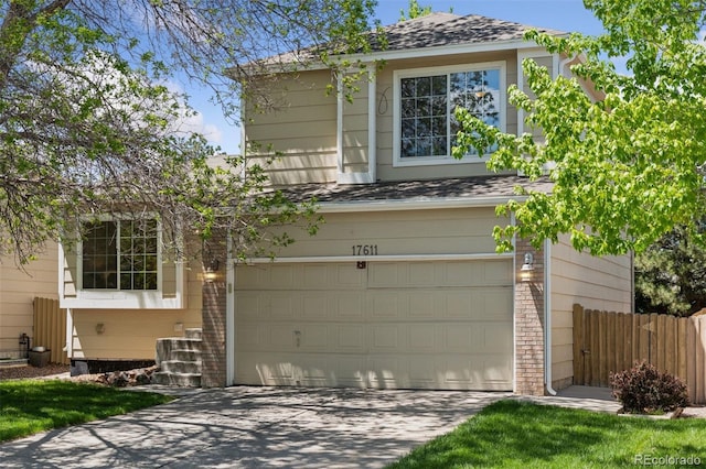 17611 Hoyt Pl, Parker, CO 80134 - traditional-style house featuring driveway, fence, a shingled roof, a garage, and brick siding