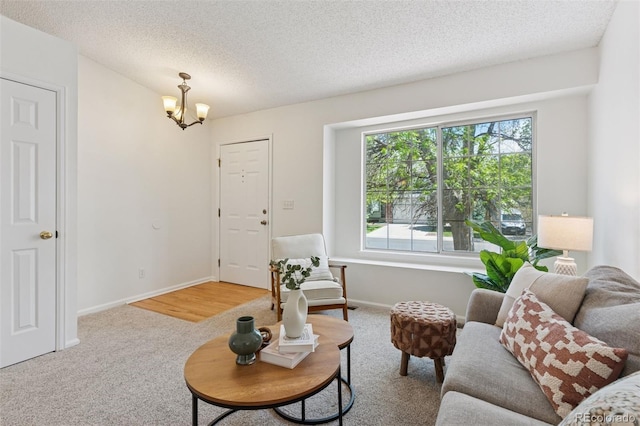 17611 Hoyt Pl, Parker, CO 80134 - carpeted living area featuring a chandelier, healthy amount of natural light, a textured ceiling, and baseboards