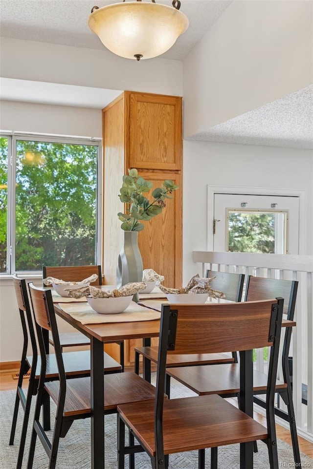 17611 Hoyt Pl, Parker, CO 80134 - dining room featuring light wood-style floors and a textured ceiling