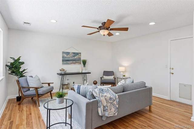 17611 Hoyt Pl, Parker, CO 80134 - living area featuring a ceiling fan, light wood-style floors, recessed lighting, baseboards, and a textured ceiling