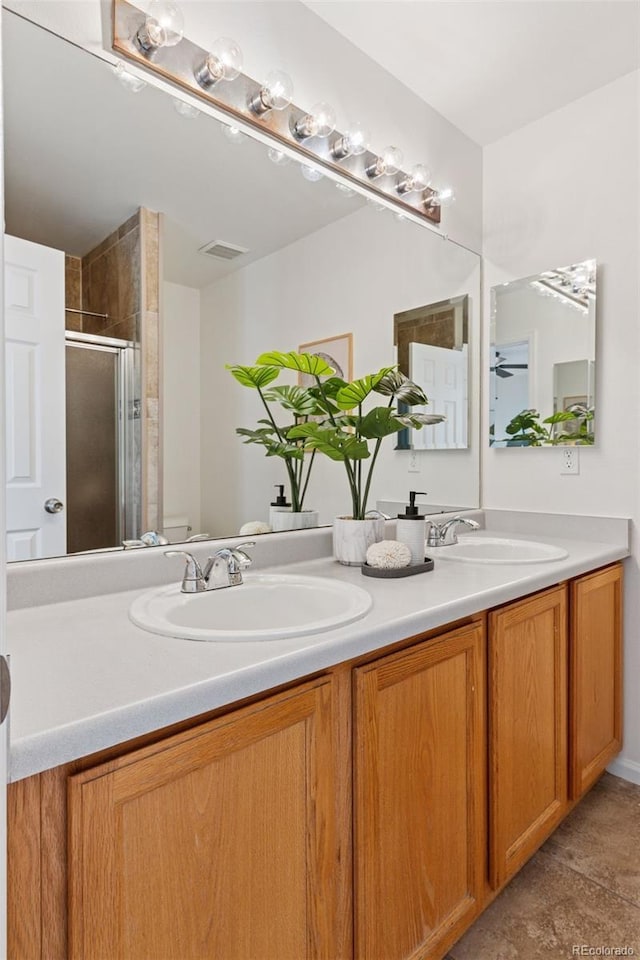 17611 Hoyt Pl, Parker, CO 80134 - full bathroom featuring a shower stall and double vanity
