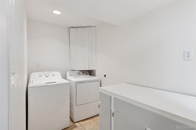 17611 Hoyt Pl, Parker, CO 80134 - laundry area with separate washer and dryer, cabinet space, and light tile patterned floors