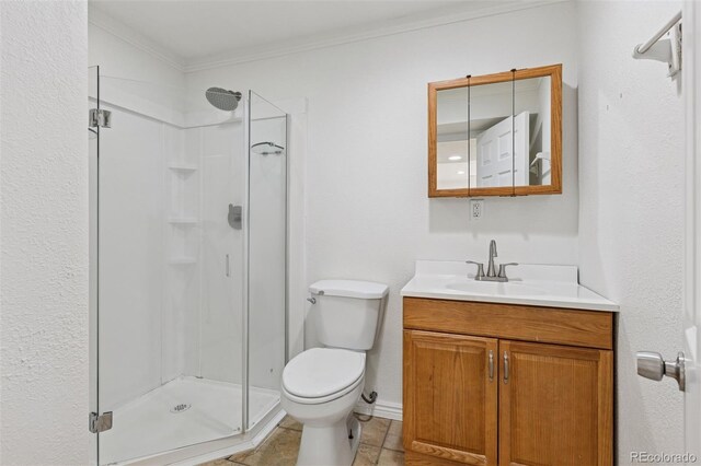 17611 Hoyt Pl, Parker, CO 80134 - full bath featuring a shower stall, crown molding, toilet, vanity, and tile patterned flooring
