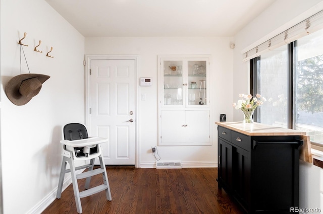 3004 S Niagara Way, Denver, CO 80224 - interior space featuring dark wood finished floors and baseboards