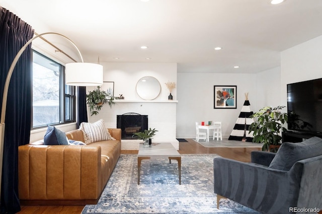 3004 S Niagara Way, Denver, CO 80224 - living room featuring wood finished floors, a brick fireplace, and recessed lighting