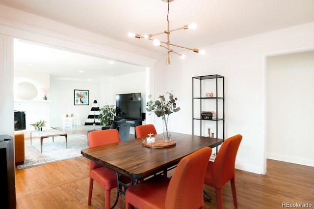 3004 S Niagara Way, Denver, CO 80224 - dining room featuring a chandelier and light wood-style flooring